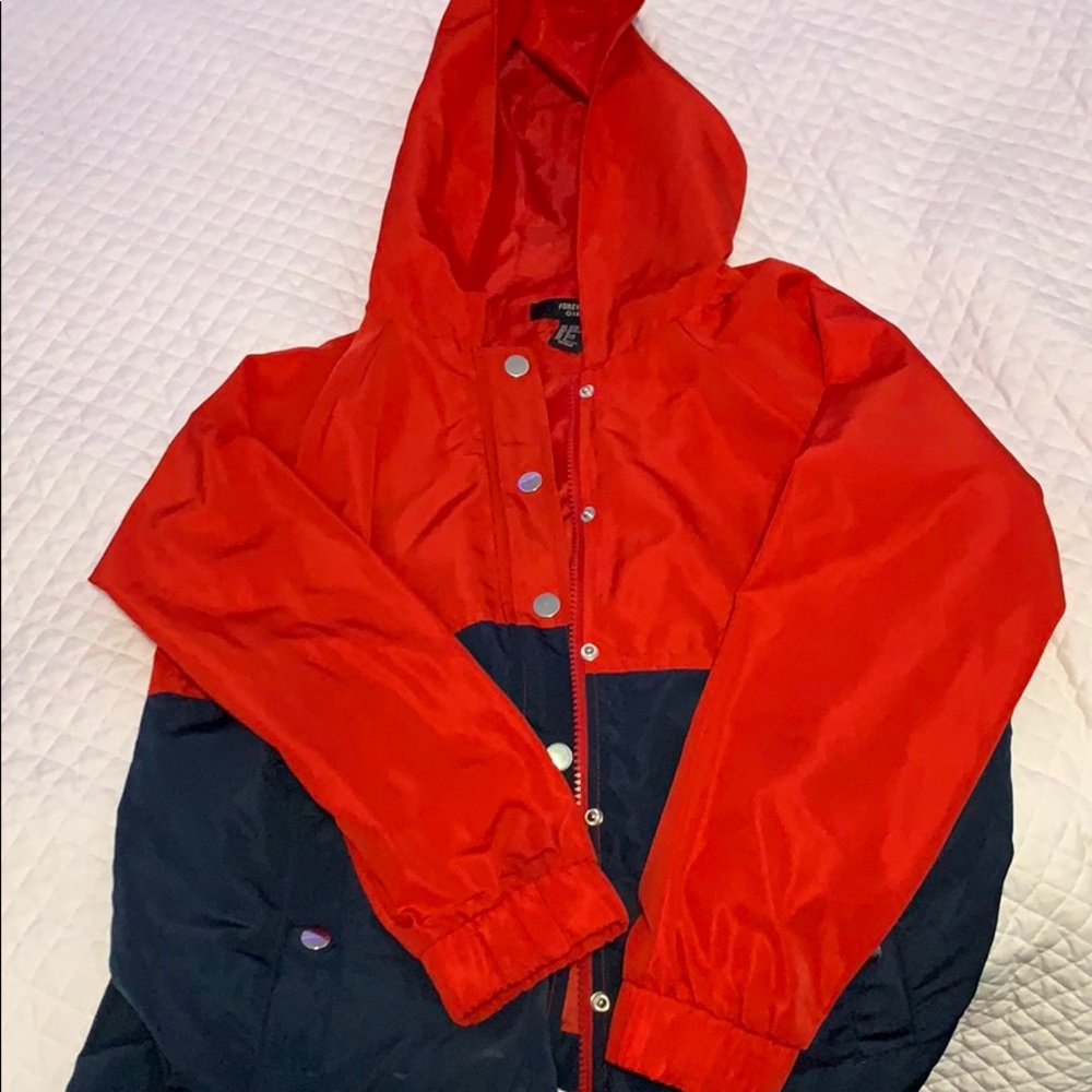 red and navy raincoat/windbreaker